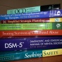stack of professional books. 