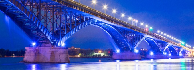 the Peace Bridge between the U.S. and Canada lit up at night. 