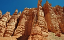 Zoom image: Upwards view of red rock cliffs