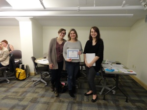 Picture of Samantha Koury and Rachel Wilson with a champion team member from the AIDS Institute Closing Training. 