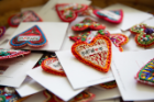 Supporters share the “Buffalove” with these hand-embroidered heart pins, which have also become popular with customers in the Buffalo Bayou region of Texas. Photographer: Meredith Forrest Kulwicki