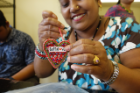 Stitch Buffalo Refugee Women’s Workshop close-up of a Buffalove heart-shaped pin.