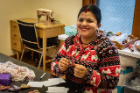 Stitch Buffalo Refugee Women’s Workshop embroidering. 