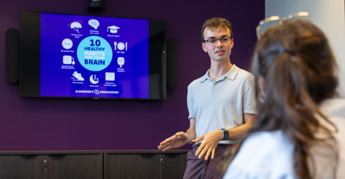 Claire Corwin, with Health and Human Services, and the Social Sciences Interdisciplinary Program, work with MSW student Brendan Quigley at the Alzheimer's Association WNY location in Amherst, NY in September 2024.