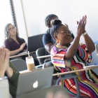 Tonya Myles-Day in a classroom with students. 