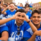 UB student forming heart with hands. 