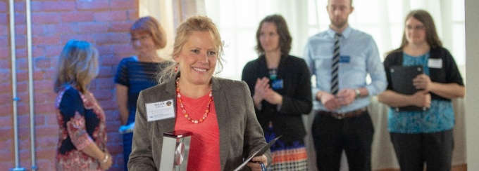 Brandi Biddeman accepting her award. 