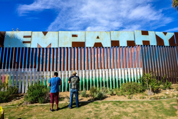 border wall that says "empathy.". 