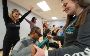 dance instructors working with blind student. 