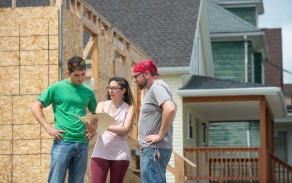 Zoom image: Habitat for Humanity Buffalo fellows Danial Khan, Paige Iovine-Wong and Josh Flaccavento at a site in-progress. 