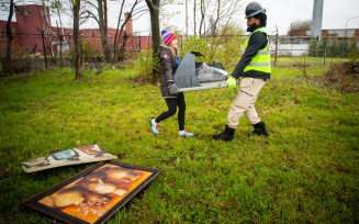 Zoom image: Volunteers — including Kristina Lazarro, student services advisor, and Ronald Dixon, special project manager for crime prevention, City of Buffalo — also cleaned up several vacant lots. 