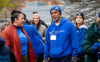 Zoom image: The day was also about camaraderie. Here, Kathryn Franco, MPH/MSW ’18, director of alumni engagement and community relations, connects with Robert Chapman, MSW ’03, executive director of the Stutzman Addiction Treatment Center. 
