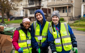 Zoom image: “I was honored to work alongside such passionate changemakers,” says Jess Williams, an undergrad in the school’s community organizing and development minor. Williams is pictured, at right, with MSW student Anita Baar and political science major Natalie Wechter. 