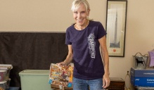 Cindy German organizing items in her home. 