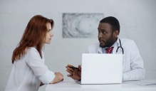 A patient and their doctor in a discussion. 