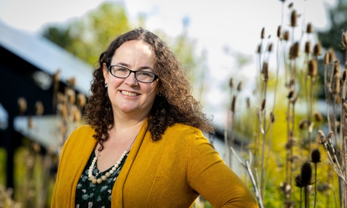 Betsy Bowen in a solar panel field on North Campus. 