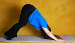 Tiffany Nhan in downward dog pose.