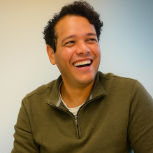 Steven Maisonet with legos in front of him. 