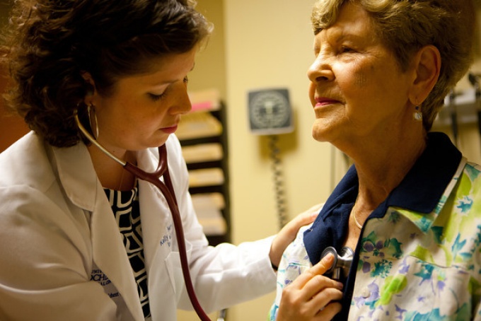 Doctor examining patient. 