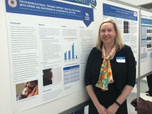Erin presenting an academic poster. 