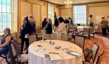 Participants at the NYSCAA conference working in groups to show how they use the values and principles of trauma-informed care in their work. 