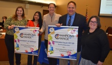 Megan Koury (left) receives the Champions of Change Award from New York State, highlighting the work done with the Student Championship Team in Niagara Falls City School District. 